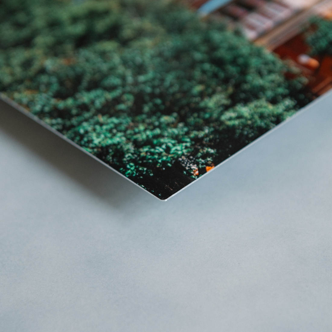 Close-up of high-definition Aluminyze metal photo print edge showing vibrant color and premium aluminum finish