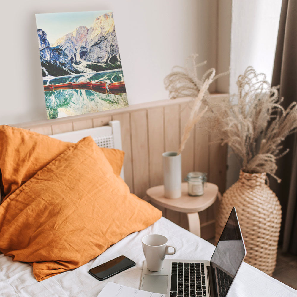 Bedroom workspace with mountain lake metal photo print on display – minimalist home office décor with aluminum wall art