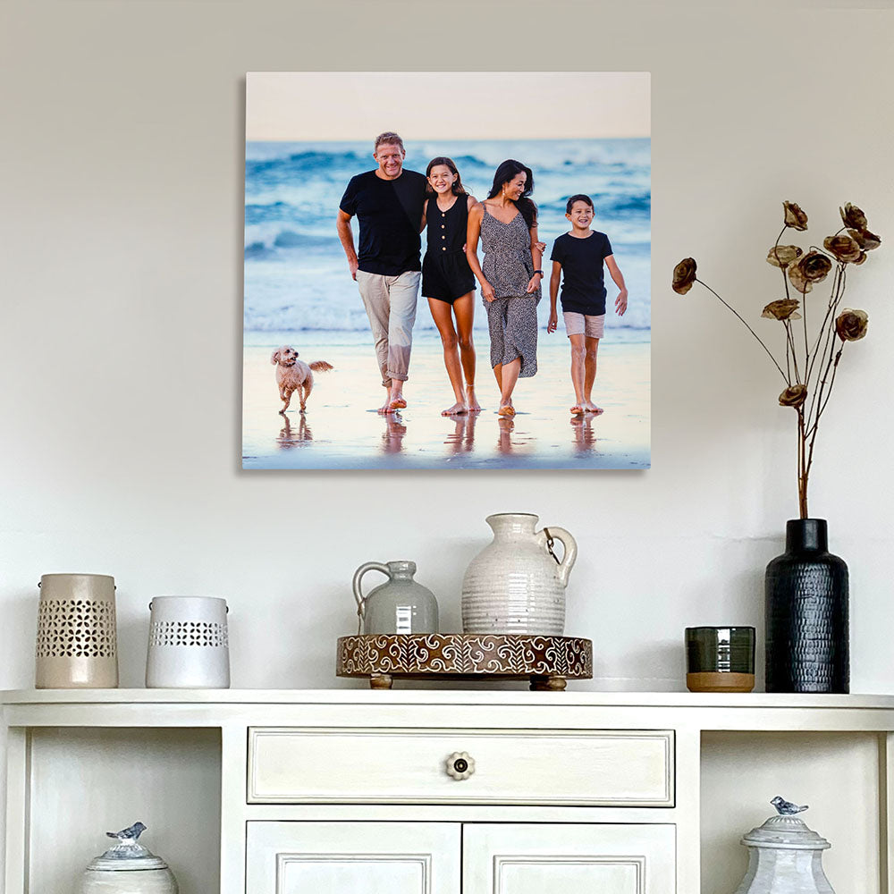 Custom aluminum family beach photo print displayed above modern white console table – high-definition metal wall art for home décor